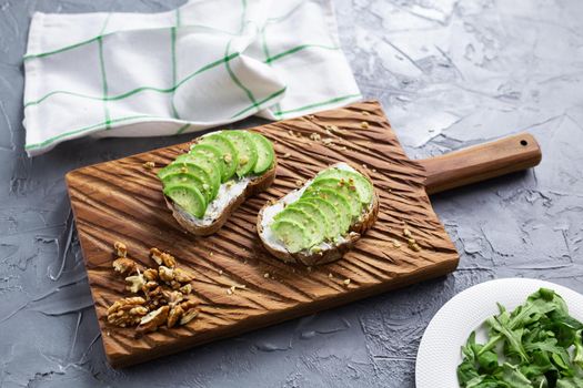 sliced avocado on toast bread with spices.