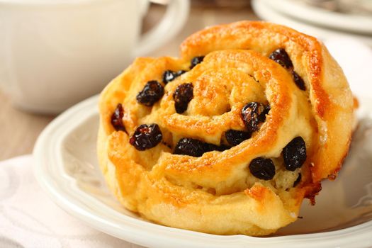 Fresh gluten free sweet swirl bun with raisins