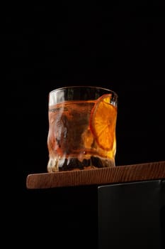 Old fashioned from below on a black background