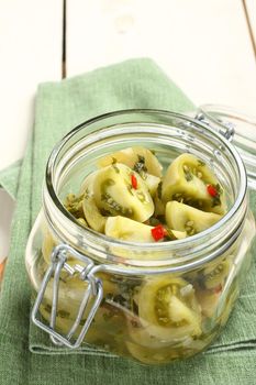 Homemade green tomatoes preserves in glass jar