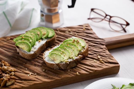 sliced avocado on toast bread with spices.