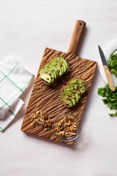 sliced avocado on toast bread with spices.