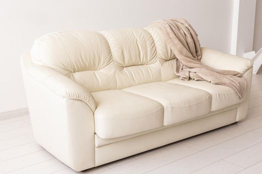 Beige sofa in room on white background. Simple minimalistic design