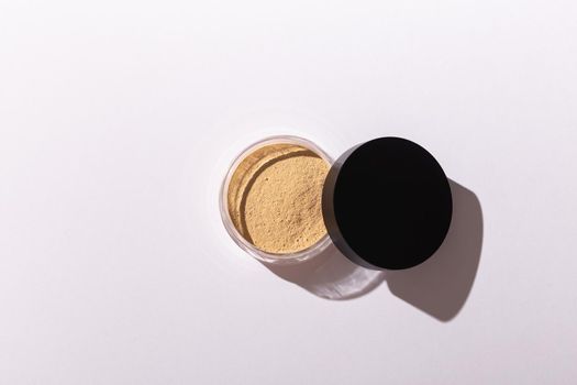 Mineral powder foundation isolated on a white background. Eco-friendly and organic beauty products.