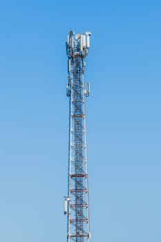 Antenna signal radio high mobile communication network on the background of blue sky.