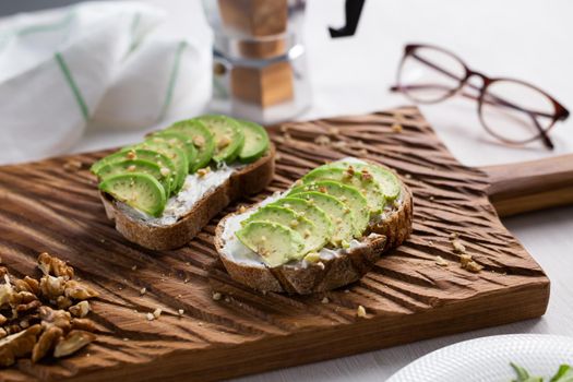 sliced avocado on toast bread with spices.