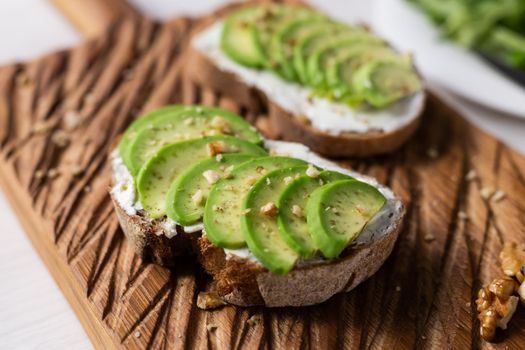 sliced avocado on toast bread with spices.