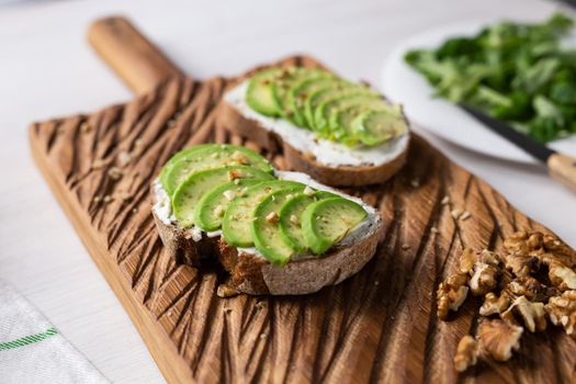 sliced avocado on toast bread with spices.