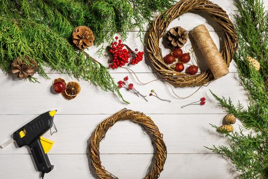 How to make christmas door wreath. The working process. The decorator's workplace. Top view. Copy space. Still life. Flat lay.