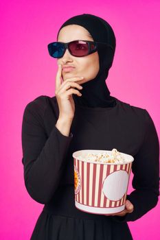cheerful woman in 3D glasses popcorn entertainment movies studio lifestyle. High quality photo