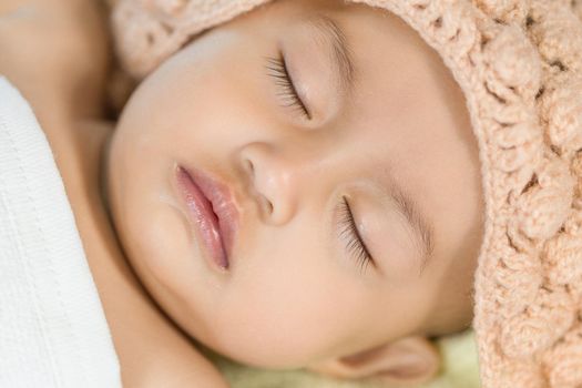 Baby sleeping on bed in the bedroom at home