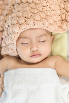 Baby sleeping on bed in the bedroom at home