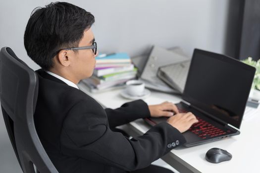 young business man using laptop computer