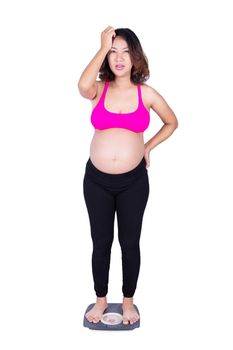 Worried pregnant woman on scale isolated on white background