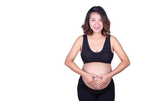 Pregnant Woman holding her hands in a heart shape on her belly isolated on white background