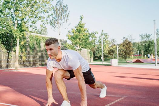 man doing exercises outdoors on the playground. High quality photo