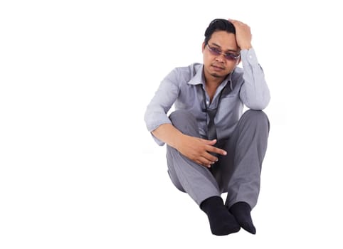 stressed businessman touching his head and thinking isolated on white background