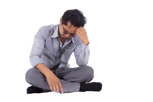 stressed businessman touching his head and thinking isolated on white background