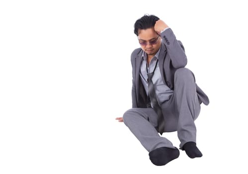 stressed businessman touching his head and thinking isolated on white background