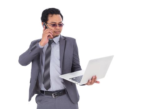 business man talking on mobile phone and holding laptop isolated on a white background