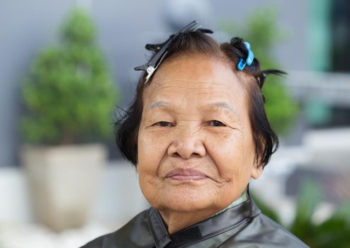 senior woman with hairpin on her hair