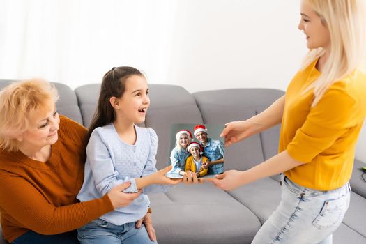 woman holding a photography with gallery stretch on a wooden frame. Printed photo on canvas.