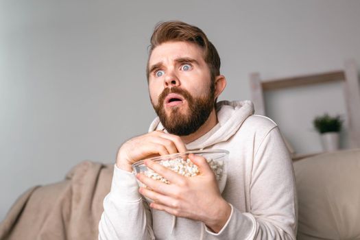 Portrait of guy watching TV series online. Online cinema and video streaming service
