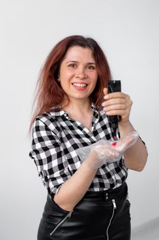 Young woman dyes her hair at home. Bright hair coloring