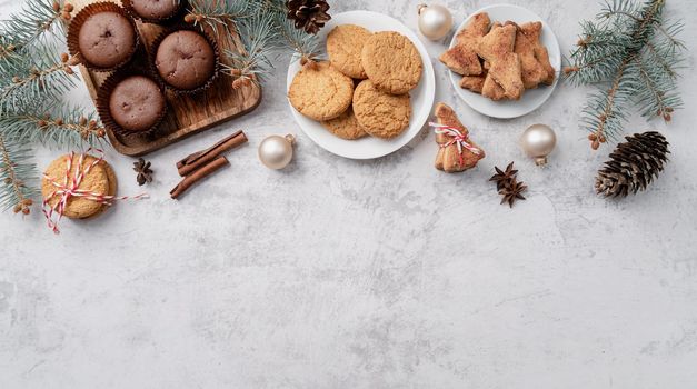 top view christmas cookies, muffins and gingerbread flay lay with copy space
