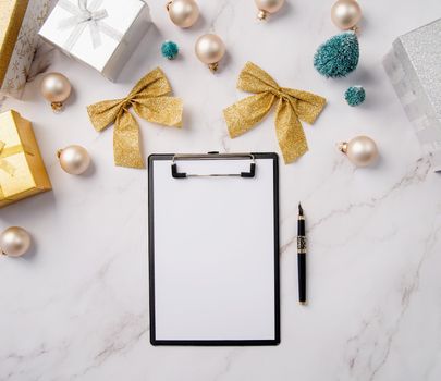 New Year Resolution and Motivation Concept. top view writing new year goals, resolution or shopping list on a blank paper. Mock up design