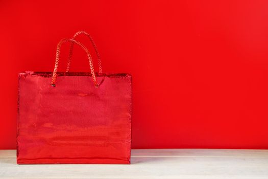 Black friday sale concept. Red shopping bag. Banner for advertising.