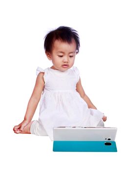 baby playing with digital tablet isolated on a white background