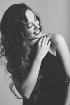 Portrait of brunette woman with long hair wearing black t-shirt