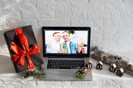 video call celebrating christmas by laptop online during coronavirus outbreak.