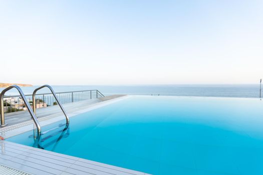 Swimming pool on top of roof deck building.