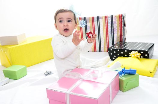 Portrait of a baby girl with gifts