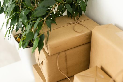 brown cardboard boxes stacked on each other on white.