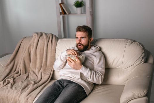 Portrait of guy watching TV series online. Online cinema and video streaming service