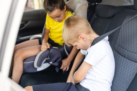 Cute children in car, boy and girl in the car