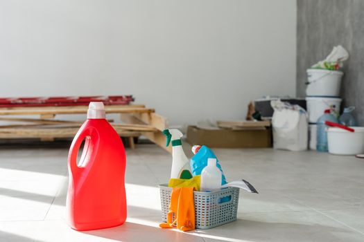 Cleaning service. Bucket with sponges, chemicals bottles and mopping stick. Rubber gloves. Household equipment