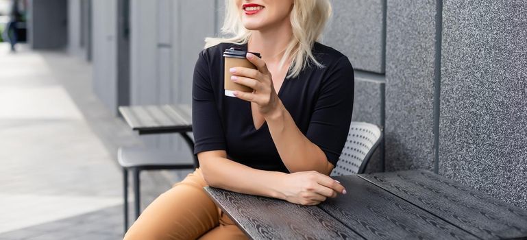 woman in a cafe drinking coffee.