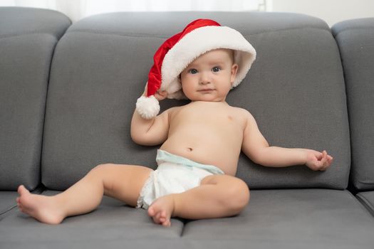 cute baby boy wearing christmas cap.