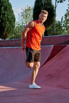 sports man on the playground in the park workout. High quality photo