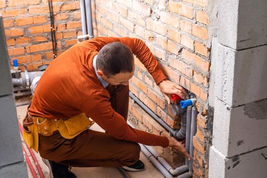 Technician servicing an hot-water heater.