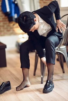 Businesswoman with very short haircut, dressing at home. Businesspeople concept.