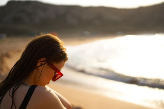 woman in a black swimsuit on the beach sea Summer vacation. High quality photo