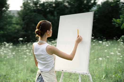 woman artist creative drawing landscape nature hobby. High quality photo