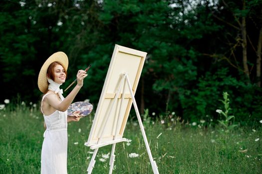 pretty woman in white dress outdoors drawing art creative. High quality photo