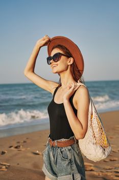 woman walking on the beach landscape sun fun lifestyle. High quality photo