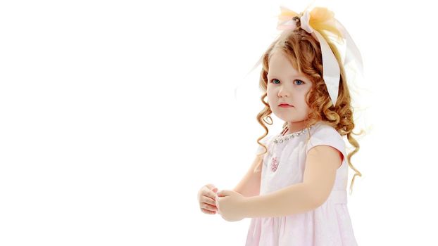 Beautiful little girl close-up. The concept of beauty and fashion, happy childhood. Isolated on white background.